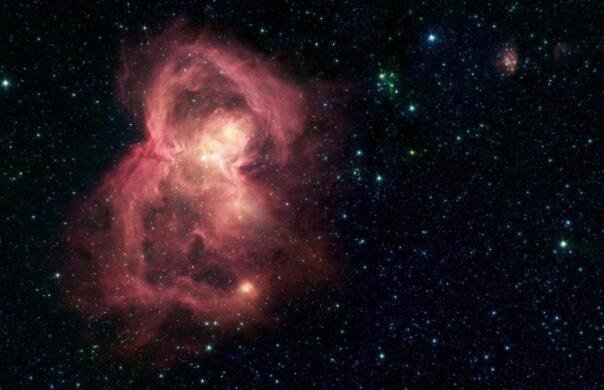 斯皮策太空望远镜发现的太空蝴蝶星云 其实是数百颗小星星的托儿所.jpg